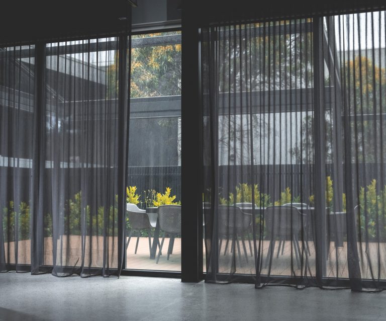 Rollease Acmeda motorised curtain hardware now available in black